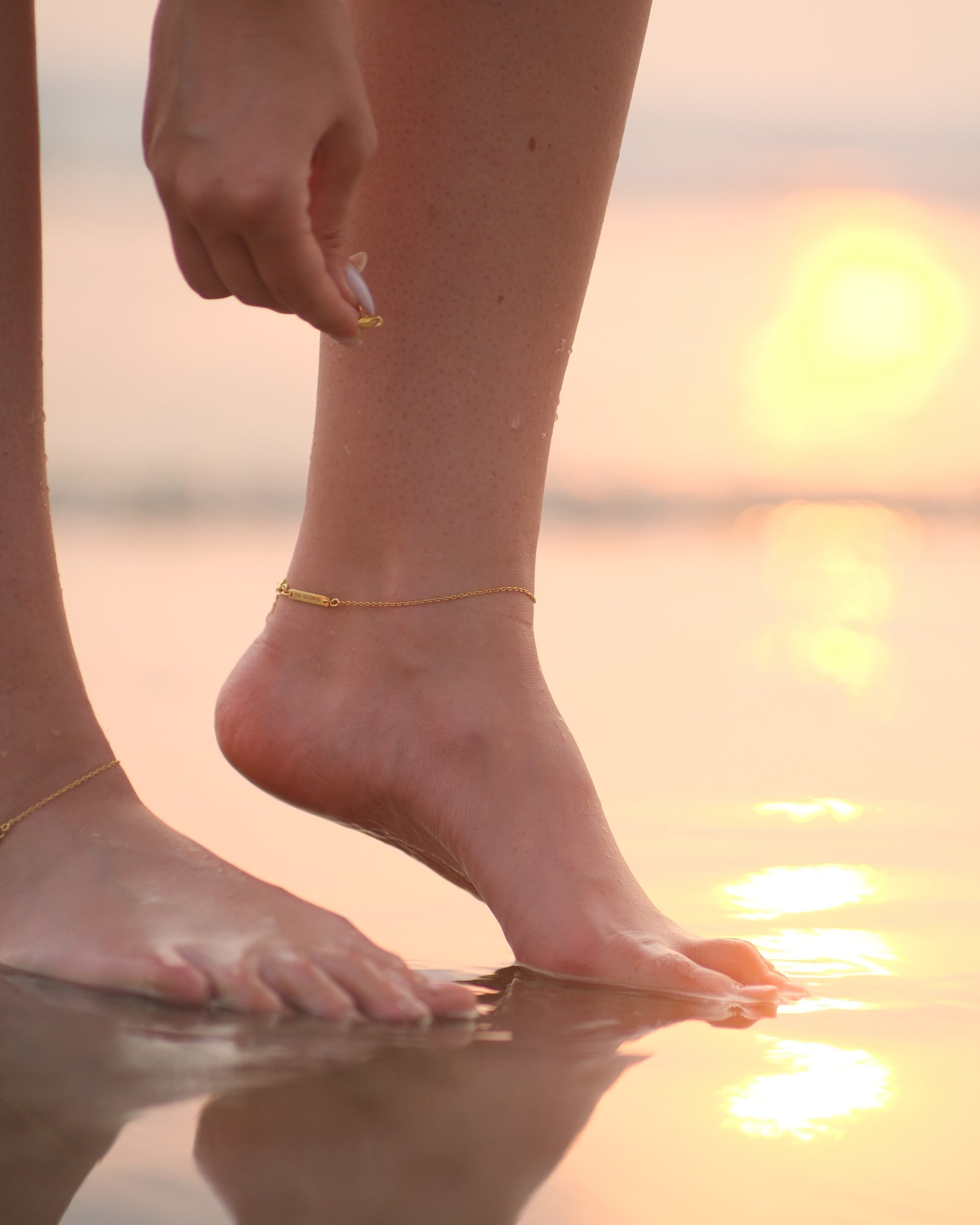 Detailed shot of adjustable chain and lobster claw clasp on Aethic anklet in 18KT gold vermeil