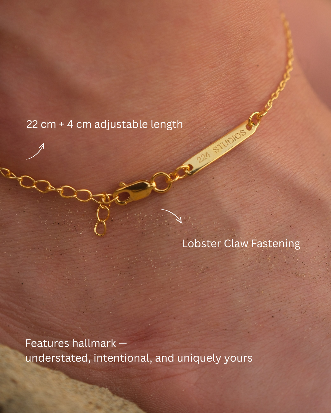 Close-up of branding mark on BareBare anklet pendant, showcasing authenticity of 18KT gold vermeil