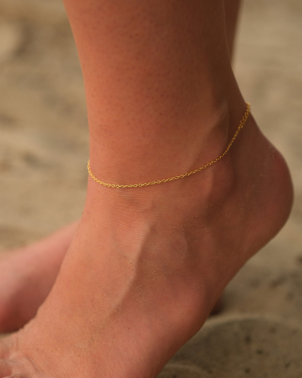Model wearing BareBare anklet showing its minimalist and barefoot-inspired design