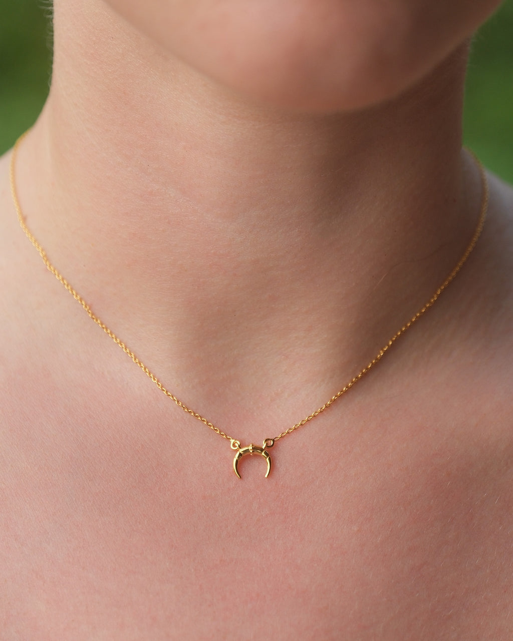 Delicate 18KT gold vermeil moon pendant necklace with adjustable chain and lobster clasp.
