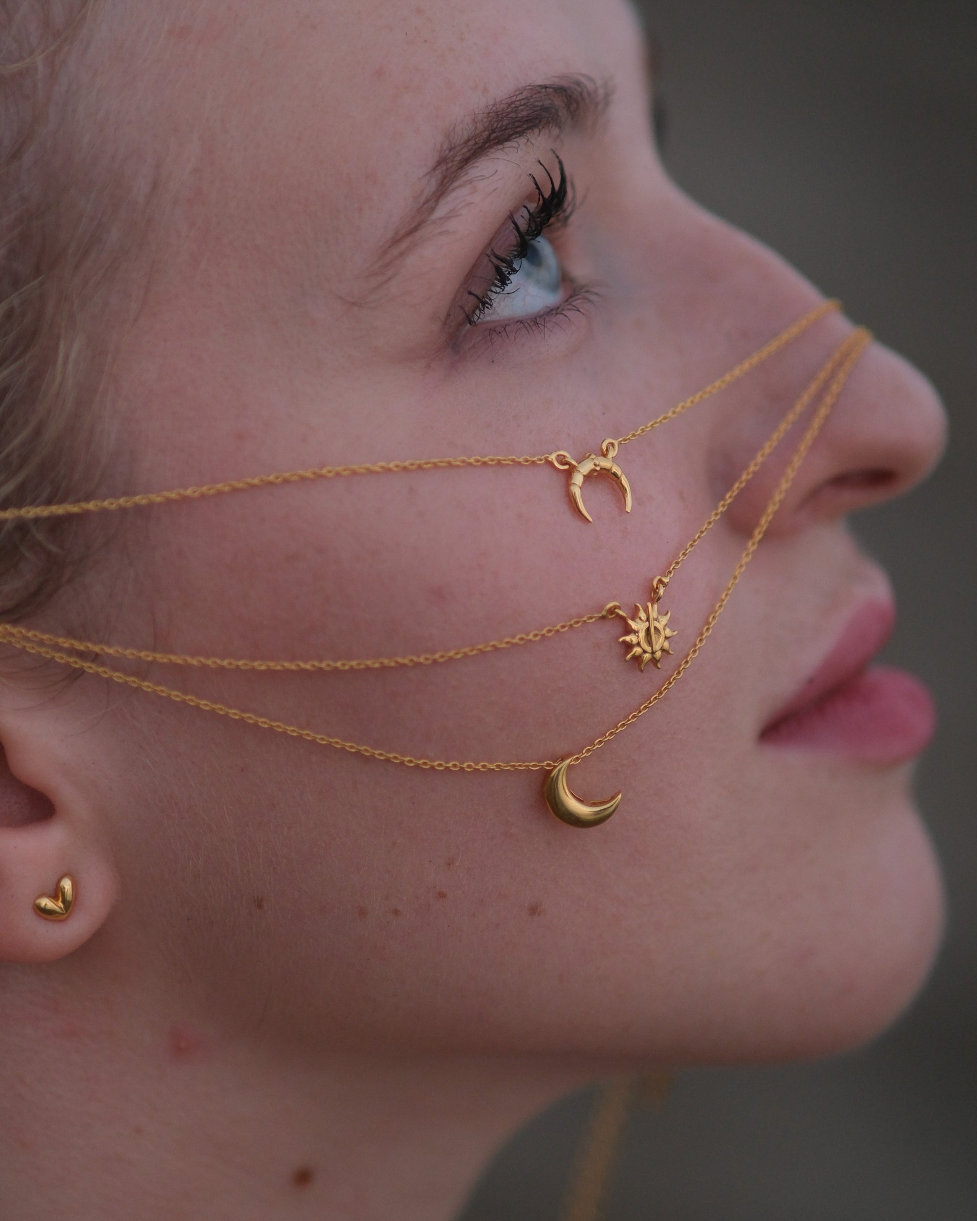 Three 18KT gold vermeil moon pendant necklaces with adjustable chains displayed together on a clean white background.