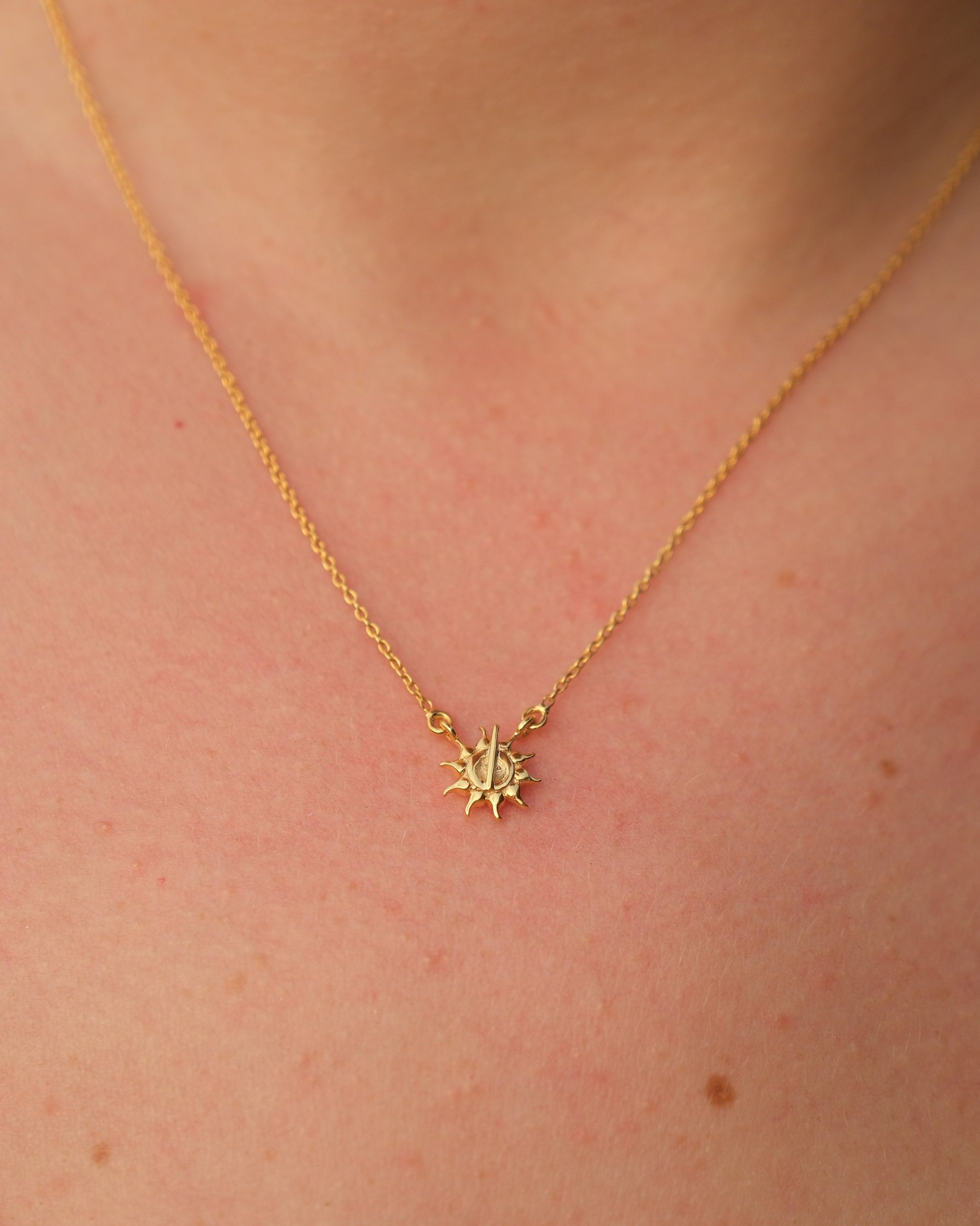 Artisan crafting the gold vermeil sun necklace by hand in Jaipur atelier workshop