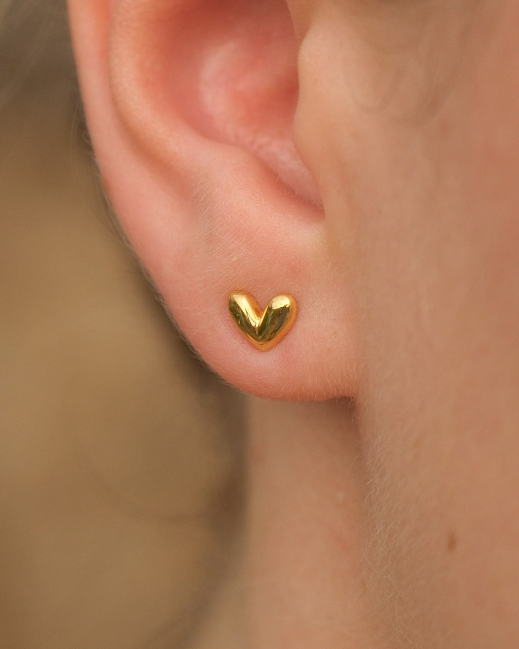 Dainty 18K gold vermeil heart studs with a raised dome design. Hypoallergenic, anti-tarnish & handcrafted in Jaipur. Perfect for lobe or cartilage piercings.
