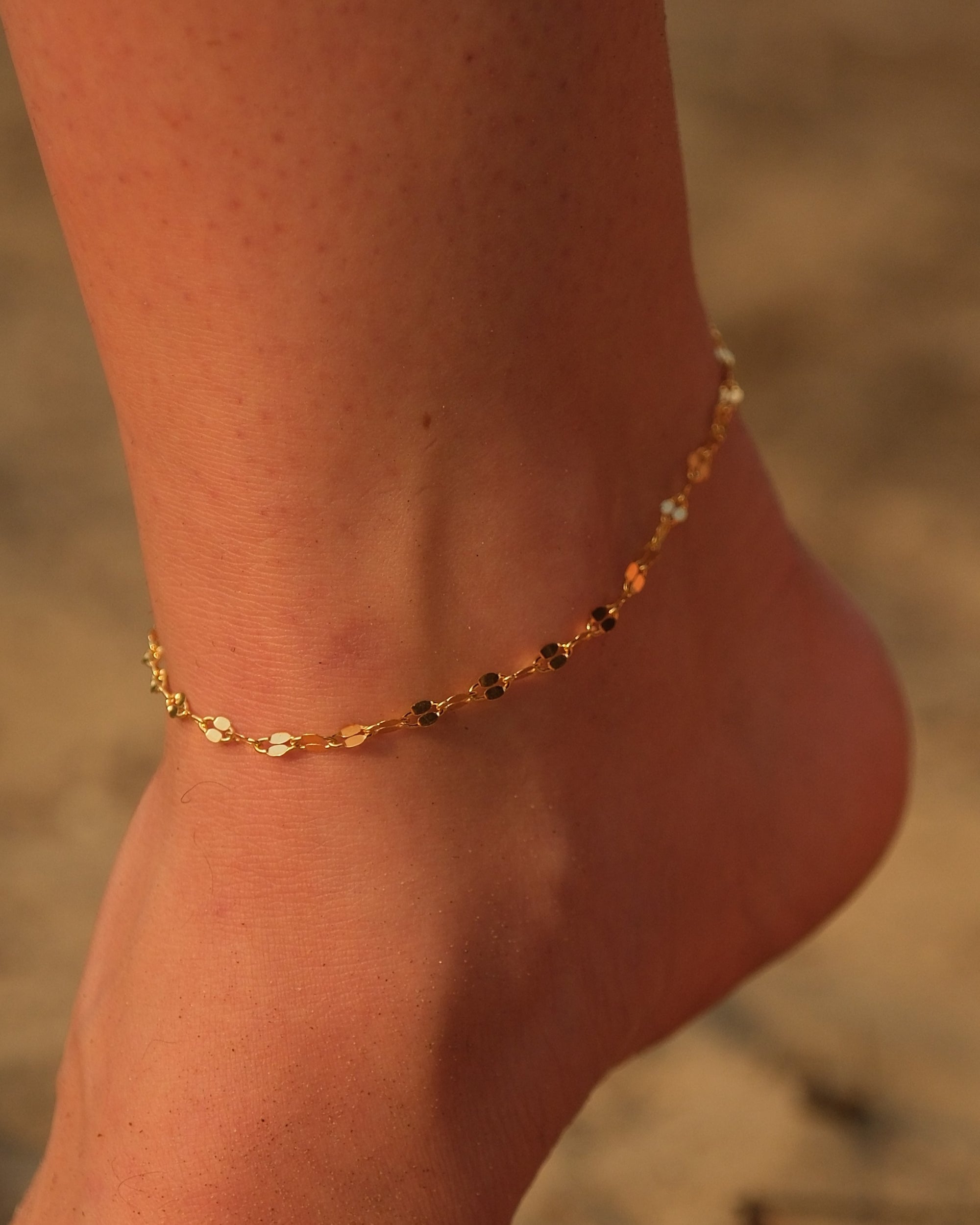 Side angle showcasing the delicate gold vermeil chain of the handcrafted Dune anklet