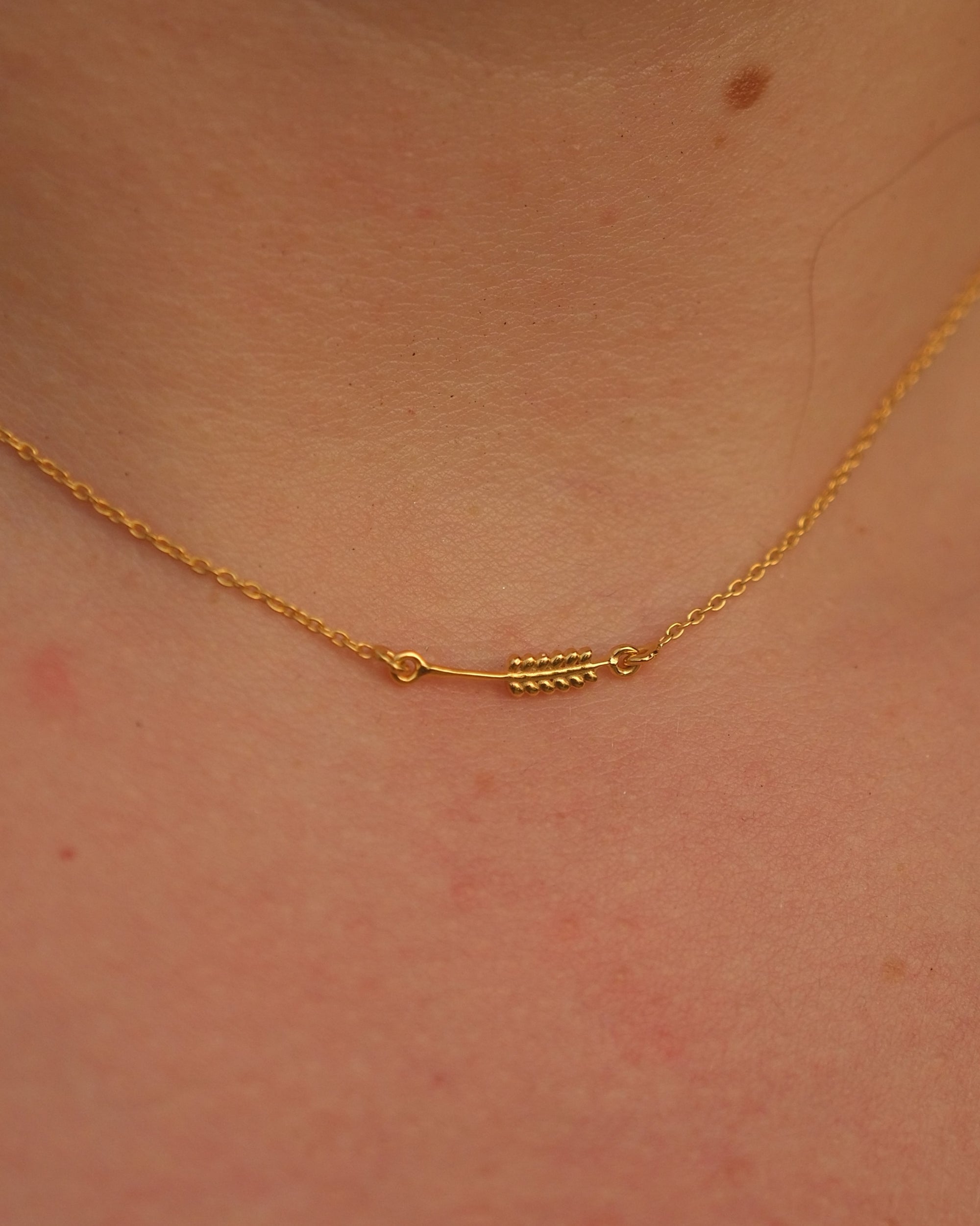 Close-up of the Sway Necklet pendant showing the intricate design and smooth finish on 18KT gold vermeil.